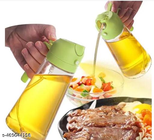 Oil dispenser pouring from spout