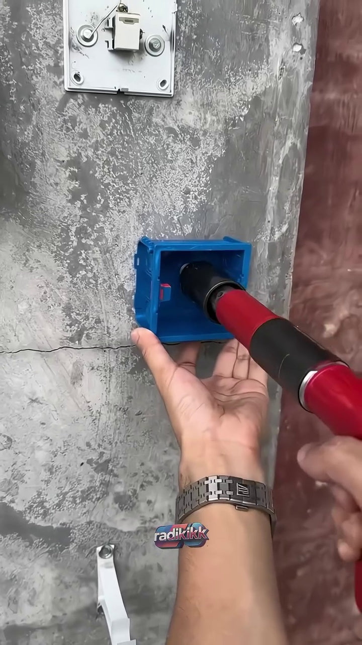 Manual concrete nail tool used with an electrical box