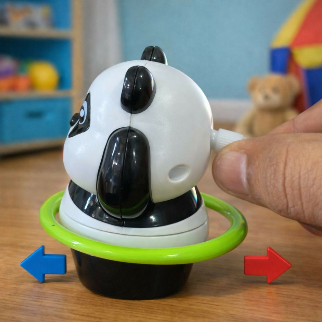 Panda toy being wound by hand