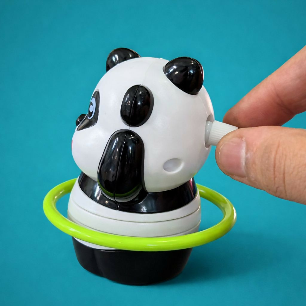 Side view of spinning ring panda toy